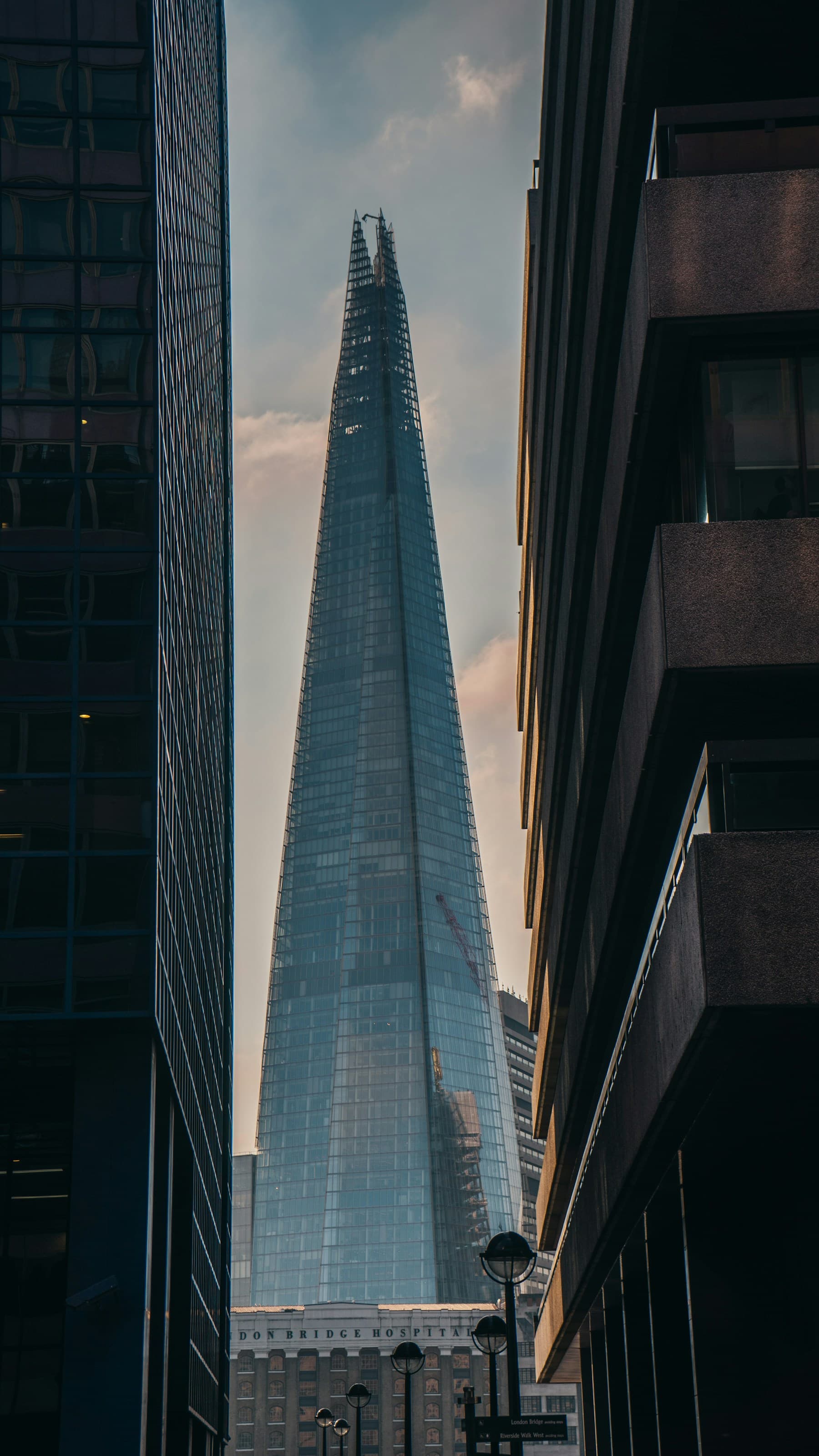 The Shard rising between City of London buildings
